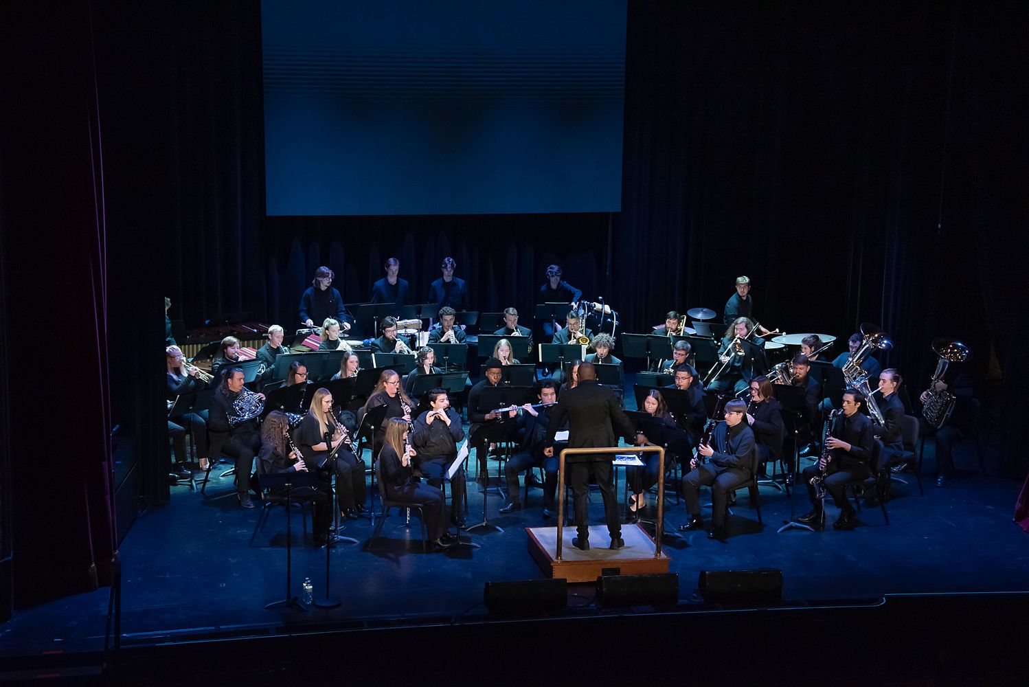 The symphonic band performing on stage