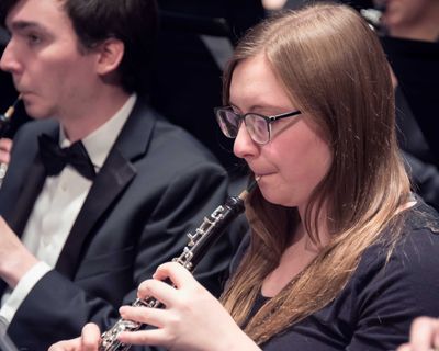 girl playing oboe during a band concert