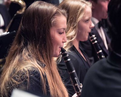 clarinet players perform during a concert